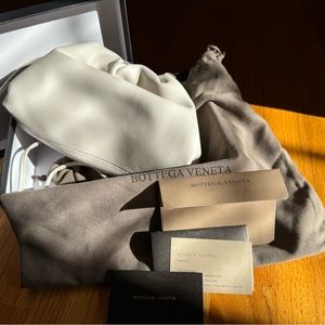 Bottega Veneta Mini leather clutch with strap